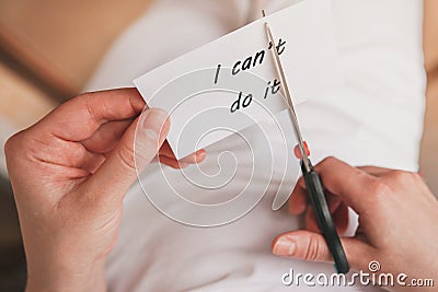 Paper with text I can't do it. Uncertainty. Determination. Make a decision. Cut off the idea. Step forward. Stock Photo