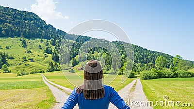 A choice of two ways. Woman at a crossroads Stock Photo