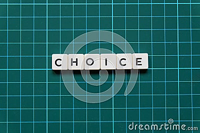 Choice word made of square letter word on green square mat background. Stock Photo