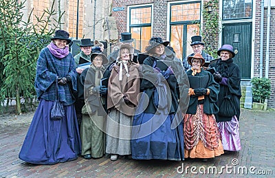 Choir of dressed actors singing inside the Dickens festival Editorial Stock Photo