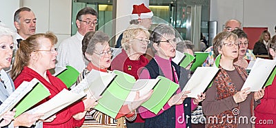 Choir singing Christmas carols. Editorial Stock Photo