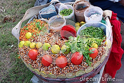 Chola chaat or Chana mixture. A street snack of kolkata It consists of chana, tomato, carrot, coriander leaves, chutney, chili, Stock Photo