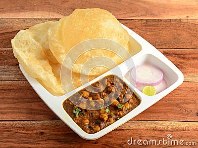 Chole Bhature, spicy Chick Peas curry also known as Chole or Channa Masala is traditional North Indian main course recipe and Stock Photo