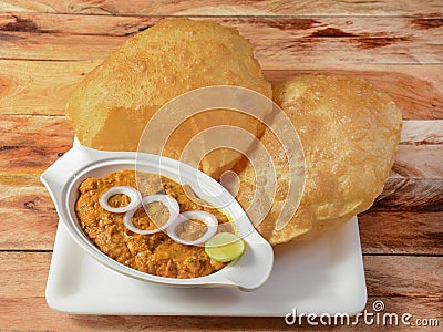 Chole Bhature, spicy Chick Peas curry also known as Chole or Channa Masala is traditional North Indian main course recipe and Stock Photo
