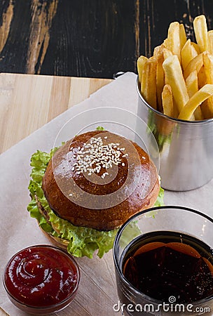 Cholesterol bomb, fast food on wooden tabletop. Stock Photo
