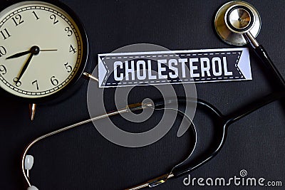 Cholesterol on the paper with Healthcare Concept Inspiration. alarm clock, Black stethoscope. Stock Photo