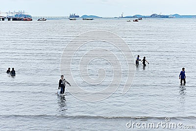 People carry basket of seashell to back home Editorial Stock Photo