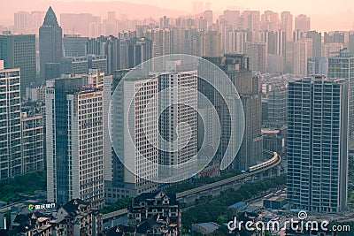 Light rail trains shuttle between high-rise buildings Chongqingï¼Œ China Editorial Stock Photo