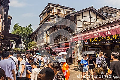 CHONGQING, CHINA - AUGUST 17, 2018: Crowded street in Ciqikou Ancient Town, Chi Editorial Stock Photo