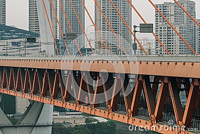 Chongqing, China - Dec 22, 2019: Qian si men suspension bridge deck over Jialing Rivier in cloudy Editorial Stock Photo