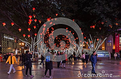 Trees at pedestrian street at night at Jiefangbei or Liberation Monument Editorial Stock Photo