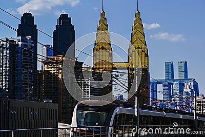 The Chongqing Ring Line in China shuttles between cities and the bustling backdrop of the city. Editorial Stock Photo