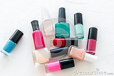 Choose nail polish. Polish bottels on white background top view copy space Stock Photo