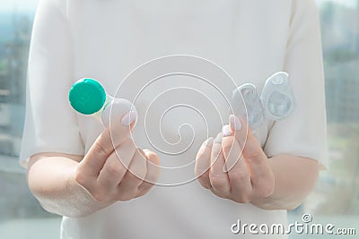 Choose between one-day contact lenses and reusable contact lenses Stock Photo