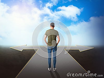 Choose your way. Man standing at crossroads taking important decision Stock Photo