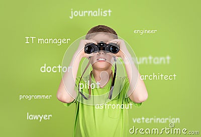 Choosing future profession concept. Cute boy with binoculars on Stock Photo