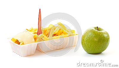 Choosing a healthy apple or an unhealthy portion of French fries Stock Photo