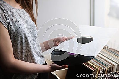 Choosing retro vinyl records in music shop Stock Photo