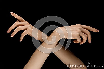 Male and female hands demonstrating a gesture of getting touch isolated on gray background Stock Photo