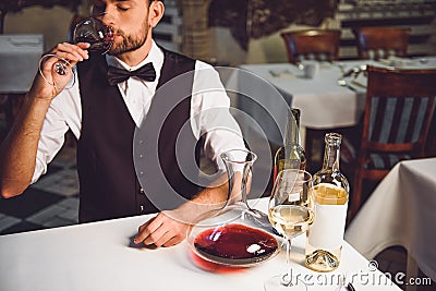 Choosing and tasting wine for repast Stock Photo