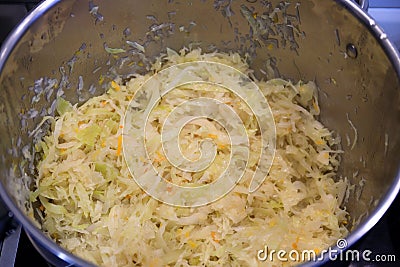 Chopped cabbage in a pot for bigos - a traditional Polish dish Stock Photo