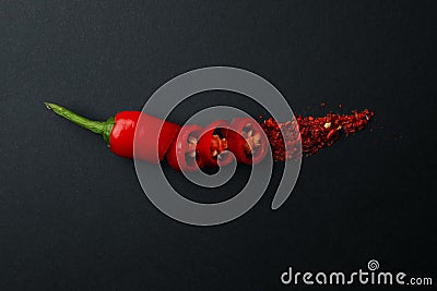 Chopped chilli pepper and spice on black Stock Photo