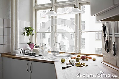 Chopped Fruit And Vegetables At Kitchen Worktop Stock Photo