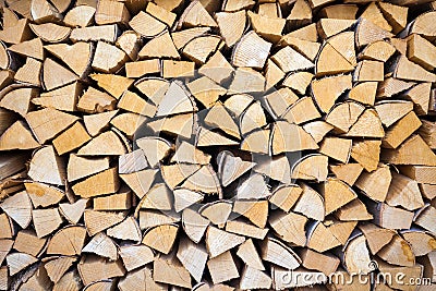 Chopped and stacked pile of wood Stock Photo