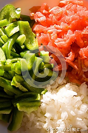 Chopped tomatoes, pepper and onions. Stock Photo