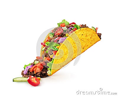 Chopped toppings spilling out of a Mexican taco isolated on a white background Stock Photo