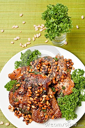 Chops from pork with cedar nutlets (top view) Stock Photo