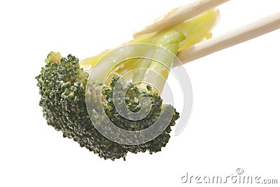 Chopsticks holding stir fried broccoli Stock Photo