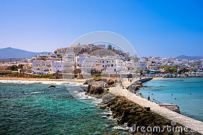 Chora of Naxos island as seen from the famous landmark the Portara with the natural stone walkway towards the village, Cyclades. Stock Photo