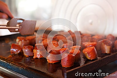 chorizo Frito a la barbacoa, barbecue meat with chorizo in a family house outdoors Stock Photo