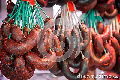 Chorizos and sausages hanging in a butchery Stock Photo