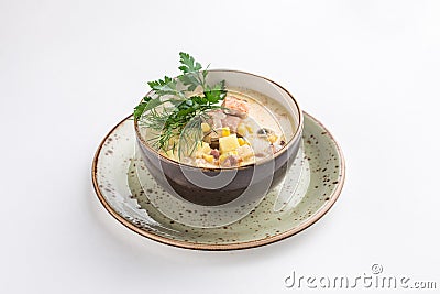 Chowder with salmon, potatoes and corn in ceramic bowl isolated on white background Stock Photo