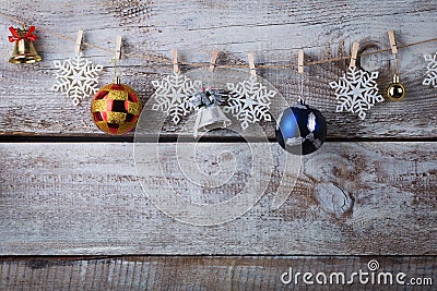 Chrismas decorations hanging on rope on wooden background Stock Photo