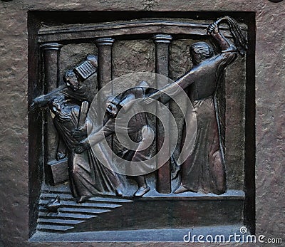 Christ Driving the Merchants from the Temple, relief on the door of the Grossmunster church in Zurich Stock Photo