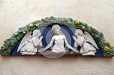 Christ in Pieta with two angels in Adoration, lunette, Basilica di Santa Croce in Florence Stock Photo