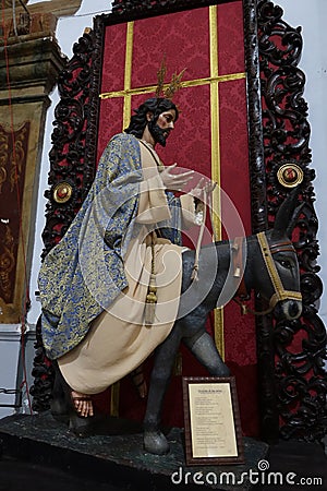 Christ riding a donkey in the Divino Salvador church in the magical Andalusian town of Cortegana, Huelva, Spain Editorial Stock Photo