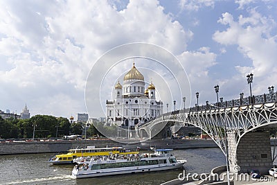 Christ savior cathedral and Patriarshy Bridge with touiristic boats sailing under the bridge Editorial Stock Photo