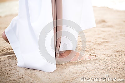 Christ walking on sand Stock Photo