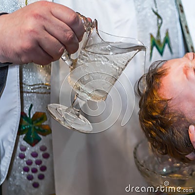 Christening ceremony of little girl in the church. Lithuania Editorial Stock Photo