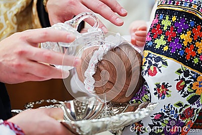 Christening newborn in church Stock Photo