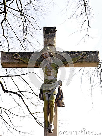 This Christian cross, with crucified Jesus, a symbol of piety, was erected in 1889 by Countess Ansembourg Stock Photo