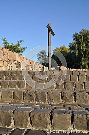 Christian cross high monument in the cemetery stairs Stock Photo