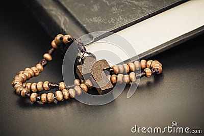 Christian cross necklace on Holy Bible book, Jesus religion concept as good friday or easter festival Stock Photo