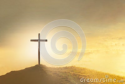 Christian Easter. Shining cross in clouds on golden sky. Ascension day concept. Faith in Jesus Christ. Christianity Stock Photo