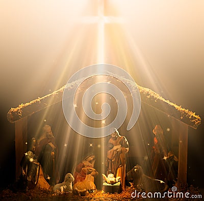 Christian nativity scene glowing in heavenly rays of light with the baby Jesus glowing in the center Stock Photo