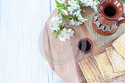 Christian Passover table with unleavened bread, a cup of wine, and flowers with copy space Stock Photo